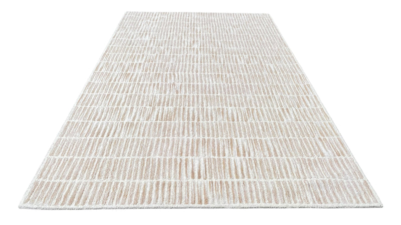 Rectangular hand tufted wool rug in sand beige with subtle grid texture and low pile