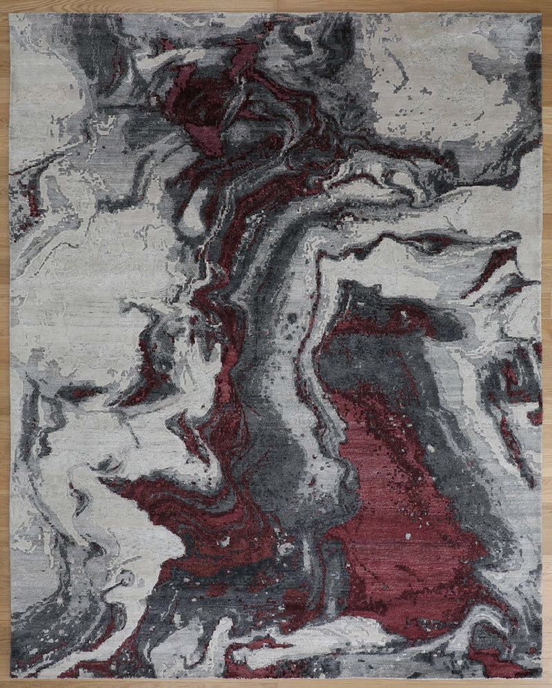 Hand-knotted wool rug with maroon and gray abstract design, dense textured pile