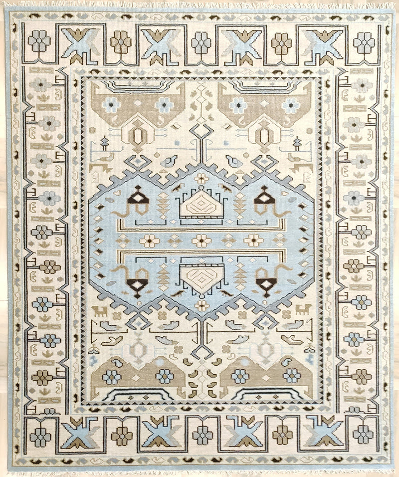Vintage geometric area rug with blue, beige, and cream pattern border