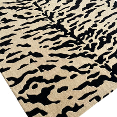 Aethel Abstract Tiger Stripe Hand Tufted Rug in Black & Sand