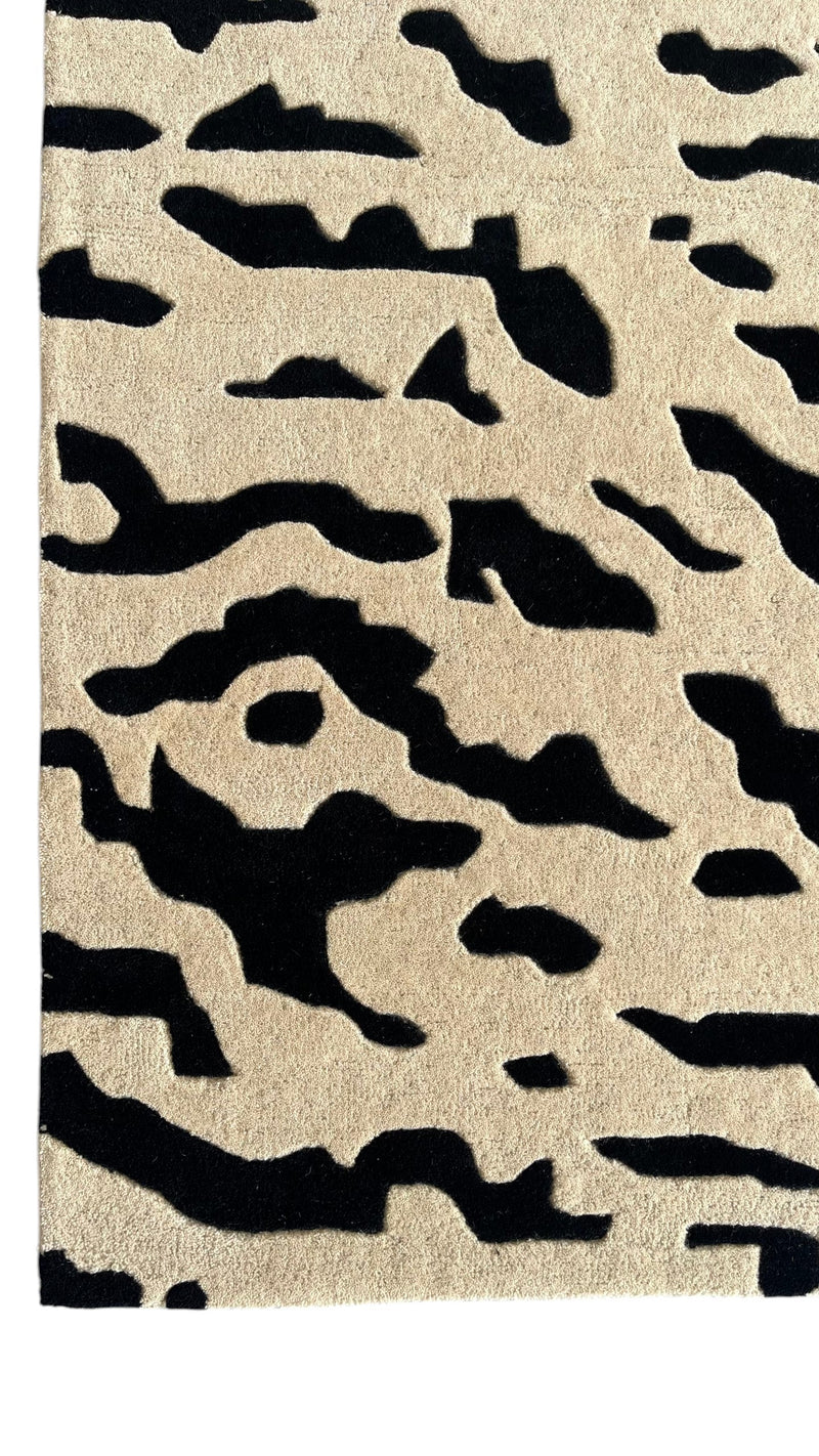 Aethel Abstract Tiger Stripe Hand Tufted Rug in Black & Sand