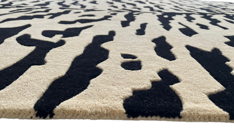 Aethel Abstract Tiger Stripe Hand Tufted Rug in Black & Sand
