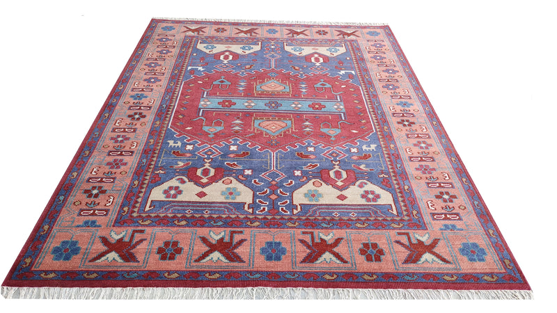 Rectangular geometric wool rug in royal blue with terracotta border and medallion