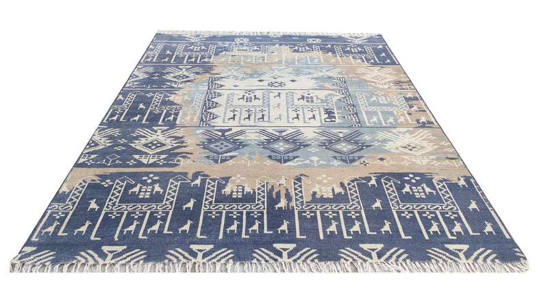 Hand-knotted wool rug in blue and beige with Southwestern geometric medallions and border