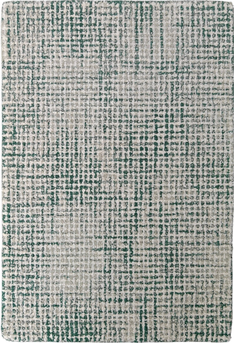 Hand-tufted wool rug with textured loop pile, ivory base with emerald green pattern
