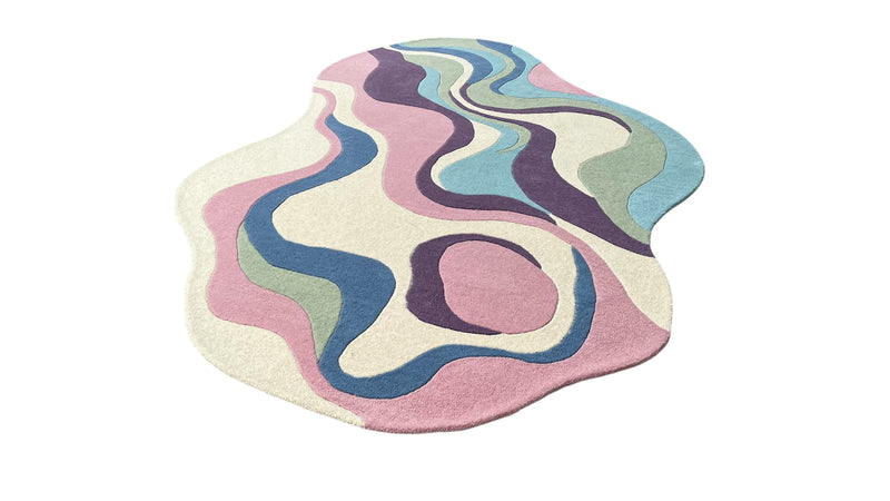 Serpentine pastel irregular wool area rug styled as a modern artistic statement piece