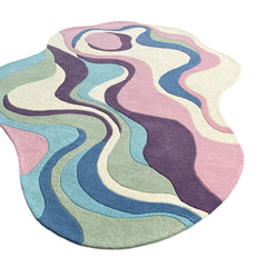 Serpentine pastel irregular wool area rug styled as a modern artistic statement piece