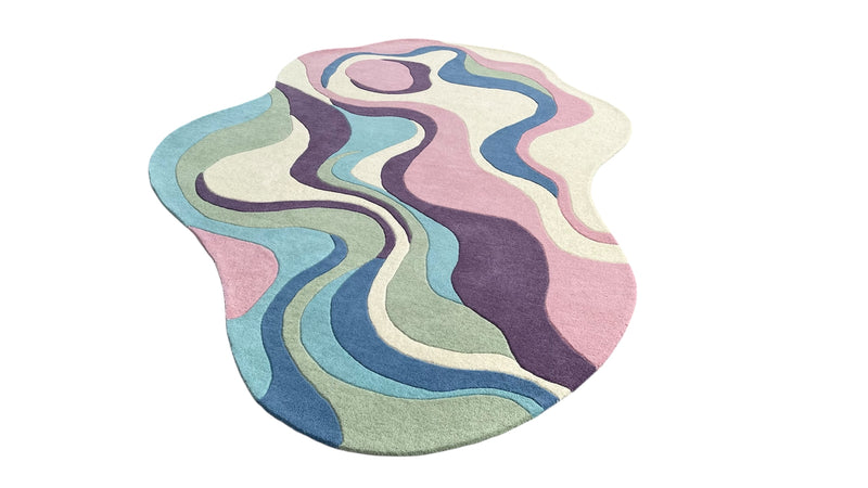 Serpentine pastel irregular wool area rug styled as a modern artistic statement piece