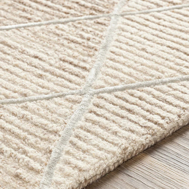 Ivory textured wool rug closeup with raised diamond trellis grid lines